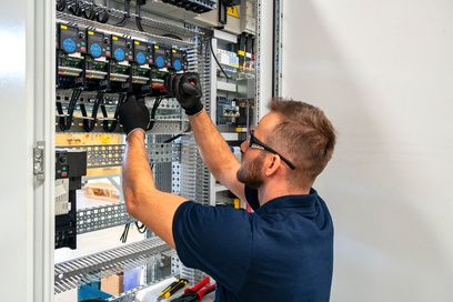 Electrician working on a distribution panel
