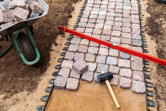 Paving stones being laid in a garden