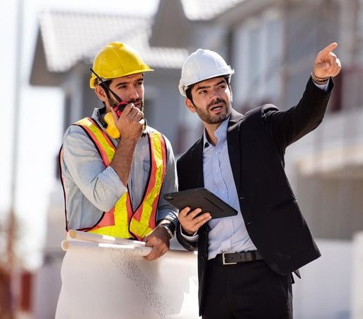 Engineers discussing a project on site